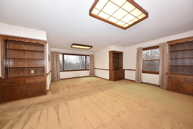 unfurnished living room with light carpet