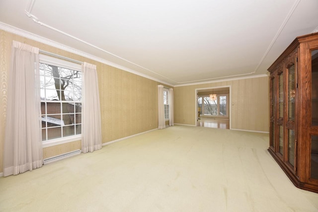 empty room with crown molding, carpet floors, and a wealth of natural light