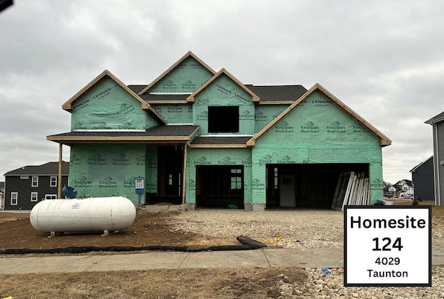 unfinished property featuring a garage