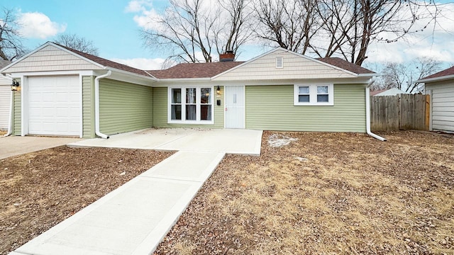 ranch-style home featuring a garage