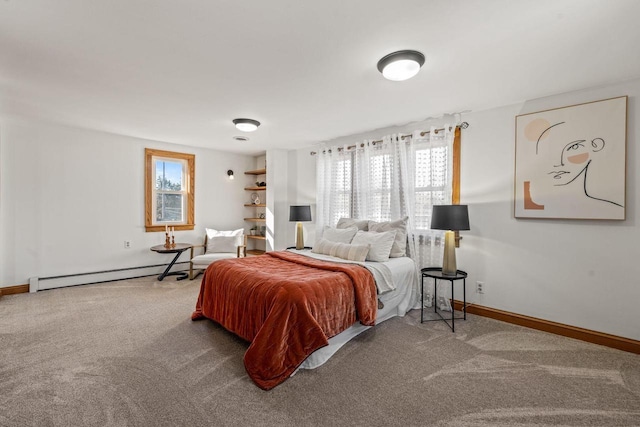 bedroom with a baseboard radiator and carpet