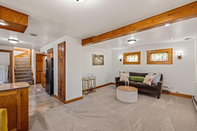 carpeted living room with a baseboard radiator and beam ceiling