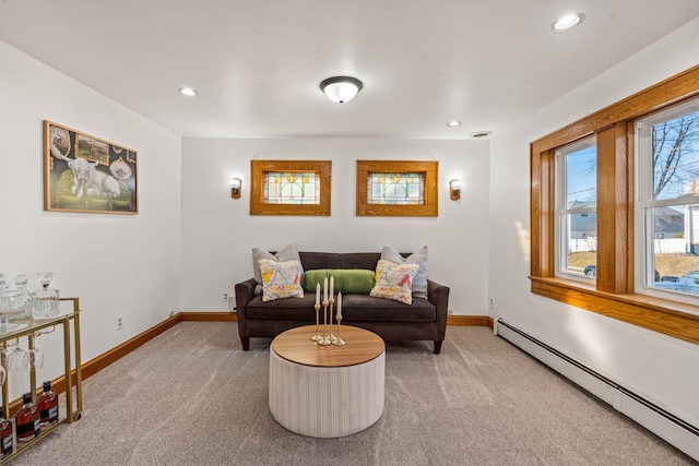 sitting room with carpet flooring and baseboard heating