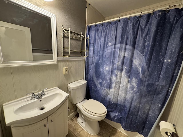 bathroom with vanity, tile patterned floors, toilet, and a shower with shower curtain