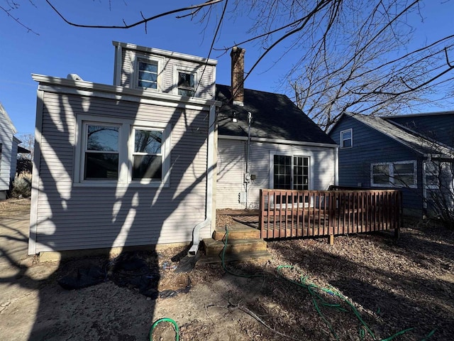 back of house featuring a deck