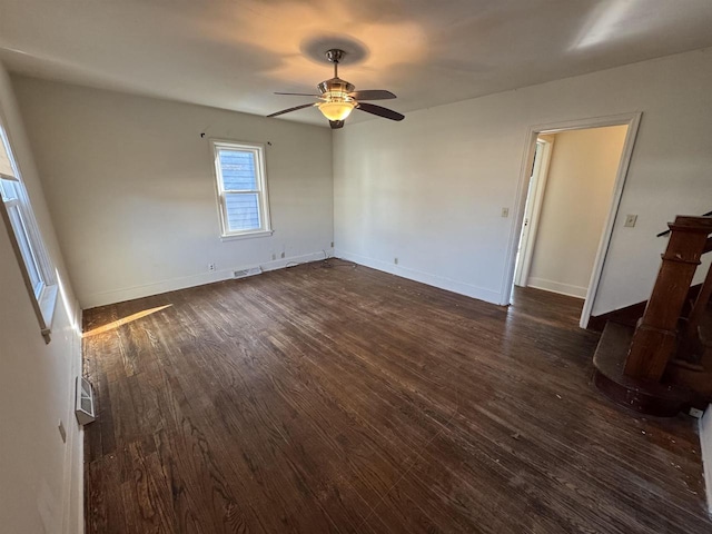 spare room featuring ceiling fan and dark hardwood / wood-style flooring