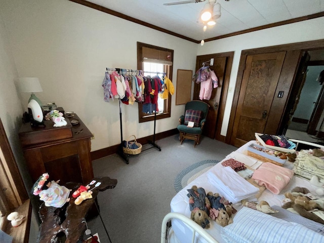 bedroom with crown molding, ceiling fan, and carpet flooring