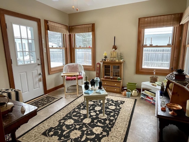 sitting room with radiator heating unit and a wealth of natural light