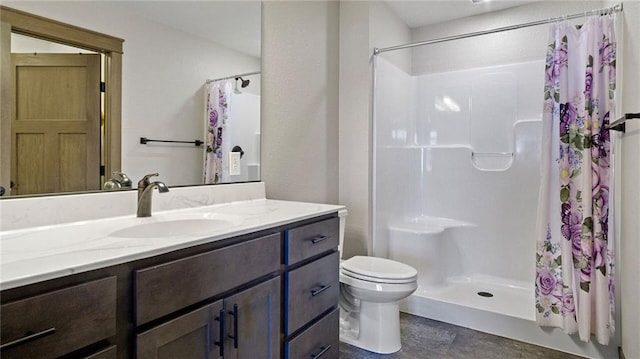 bathroom with vanity, toilet, and curtained shower