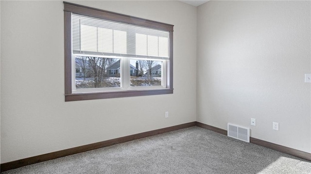 unfurnished room with carpet flooring