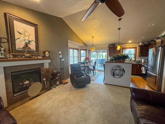 carpeted living room featuring lofted ceiling