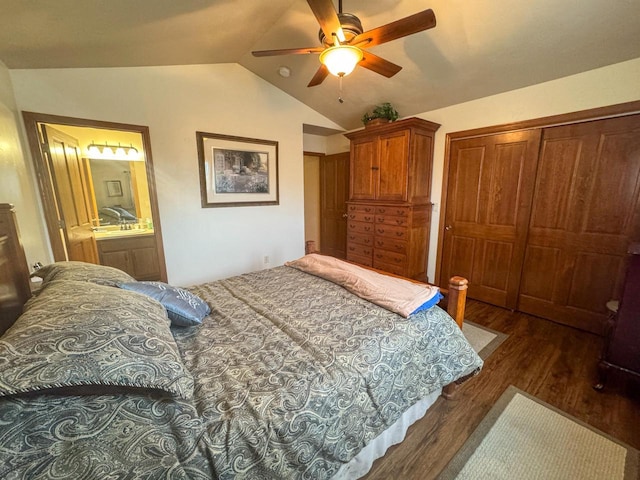 bedroom featuring vaulted ceiling, dark hardwood / wood-style floors, ceiling fan, and a closet