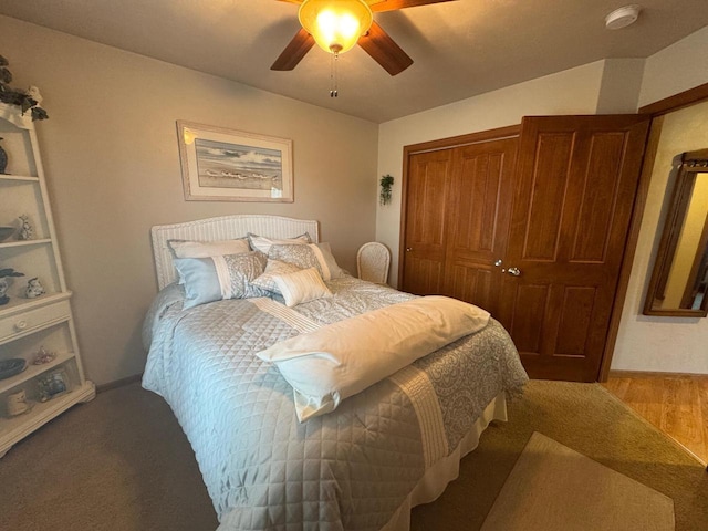 bedroom featuring hardwood / wood-style floors, a closet, and ceiling fan