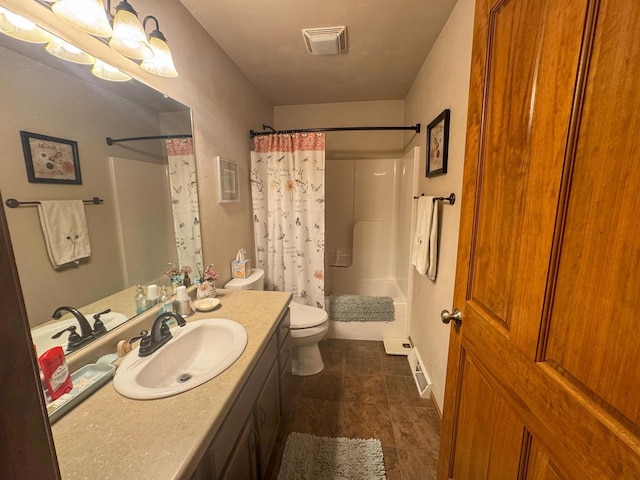 full bathroom with shower / bath combo, vanity, and toilet