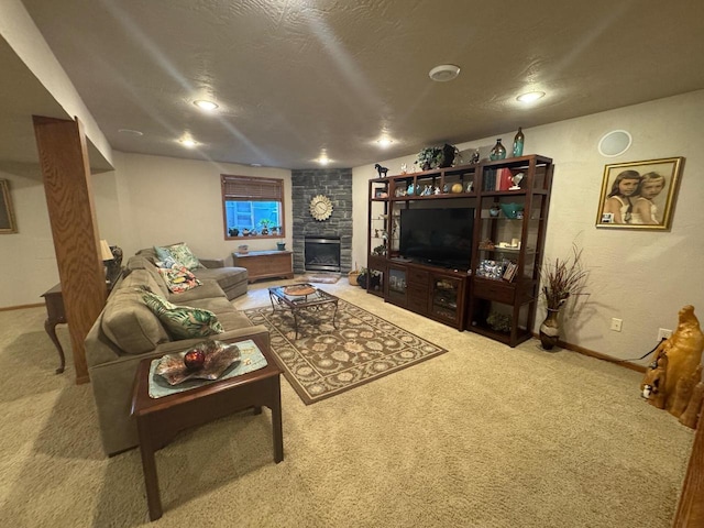 carpeted living room featuring a fireplace and a textured ceiling