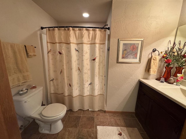 bathroom featuring vanity, tile patterned floors, toilet, and a shower with shower curtain