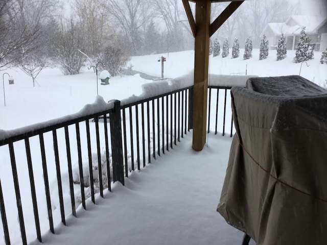 view of snow covered deck