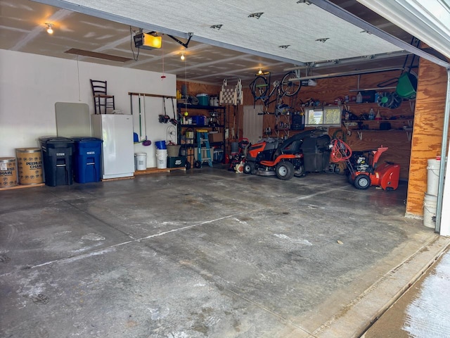 garage featuring a garage door opener and a workshop area