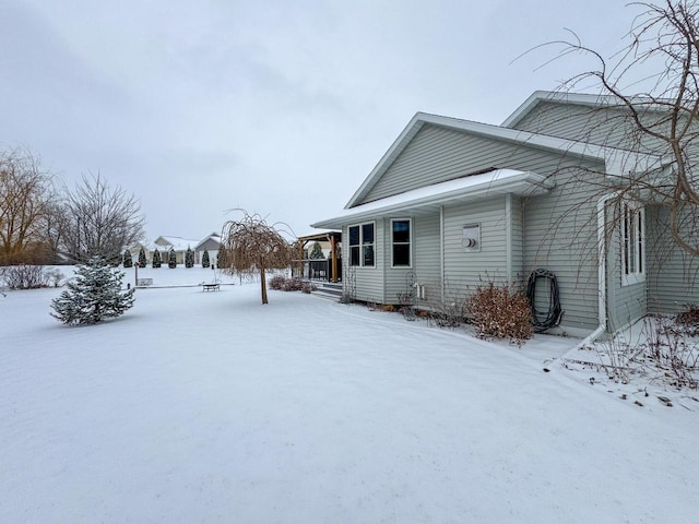 view of snow covered property