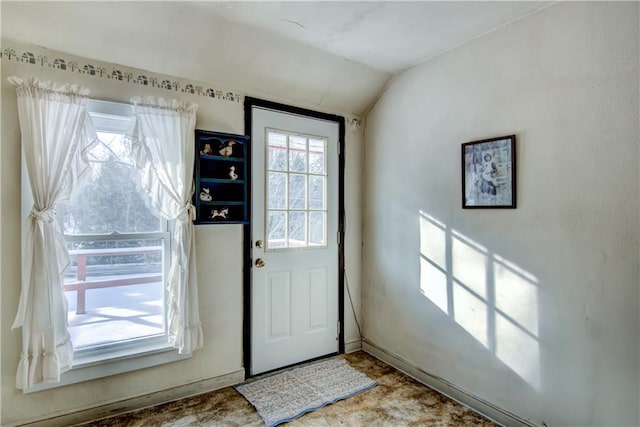 entryway featuring vaulted ceiling