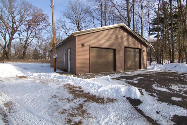 view of snow covered garage