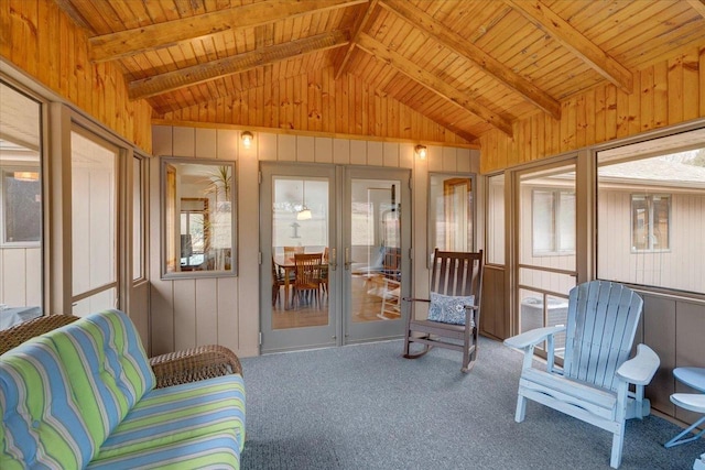 sunroom with vaulted ceiling with beams, wooden ceiling, and a healthy amount of sunlight