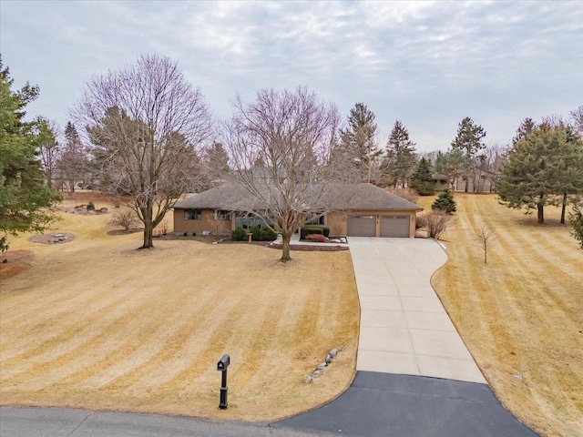 view of front of home with a garage and a front yard