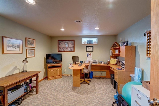 carpeted office space with a textured ceiling