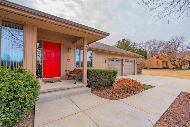 view of exterior entry featuring a garage