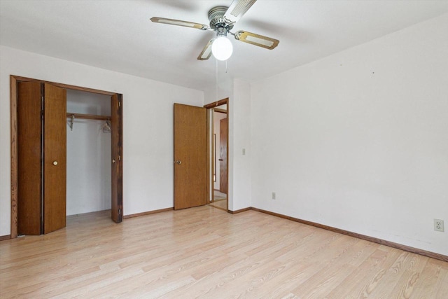 unfurnished bedroom featuring ceiling fan, light hardwood / wood-style floors, and a closet