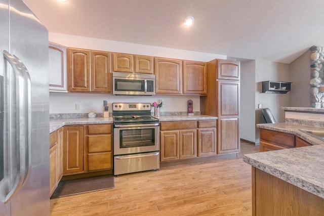 kitchen featuring sink, stainless steel appliances, and light wood-type flooring