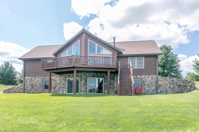 rear view of house with a yard and a deck