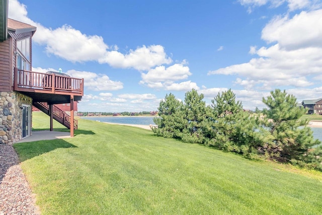 view of yard featuring a deck with water view