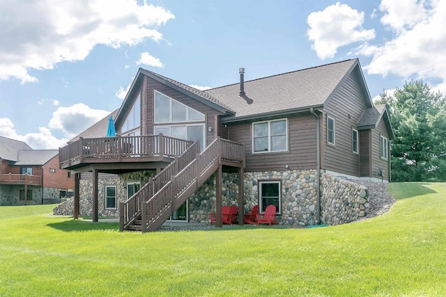 rear view of property with a lawn and a deck