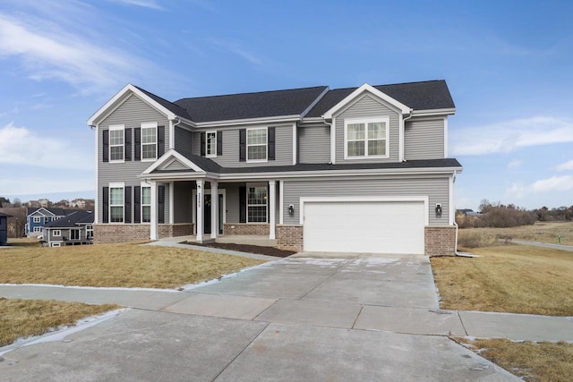 view of front of home featuring a garage and a front yard