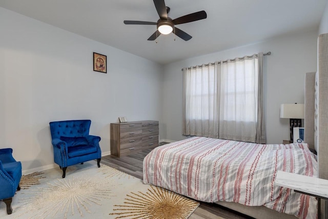 bedroom with hardwood / wood-style flooring and ceiling fan