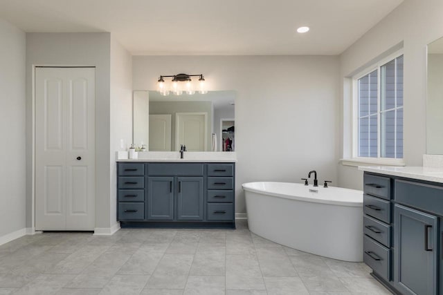 bathroom featuring a bathing tub and vanity