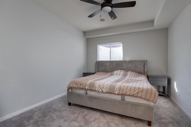 bedroom featuring ceiling fan and light colored carpet