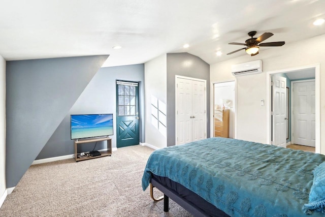 carpeted bedroom featuring vaulted ceiling, a wall mounted air conditioner, and ceiling fan