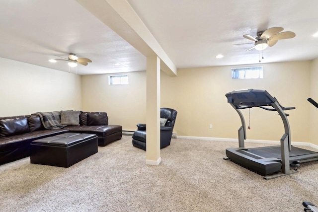 exercise area featuring ceiling fan, a baseboard radiator, and carpet