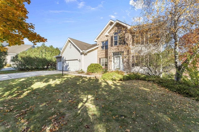 view of property with a garage and a front lawn