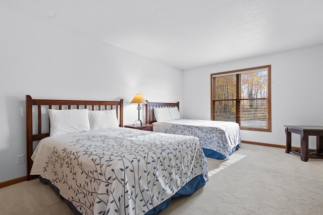 bedroom with light colored carpet