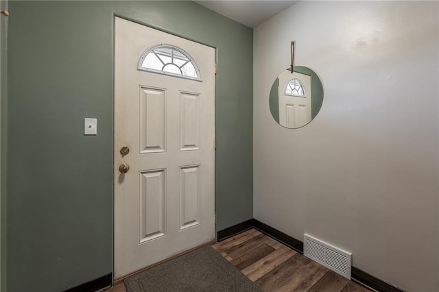 foyer entrance with dark hardwood / wood-style flooring