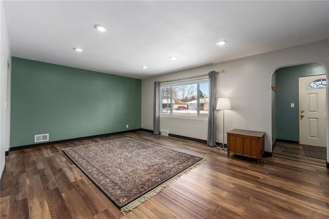 spare room featuring dark hardwood / wood-style floors