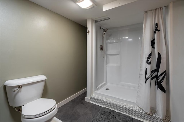 bathroom featuring tile patterned floors, toilet, and a shower with shower curtain