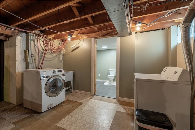 laundry room with washing machine and clothes dryer