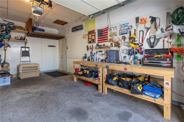 garage featuring a garage door opener and a workshop area