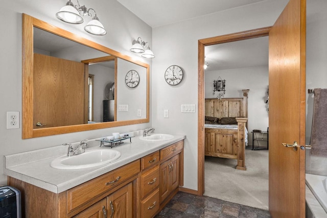 bathroom with vanity and a tub