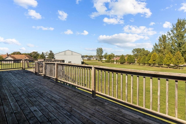 wooden deck featuring a yard