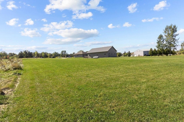 view of yard with a rural view